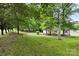 Exterior home view showcasing mature trees and well-maintained lawn at 925 Crestland Dr, Clover, SC 29710