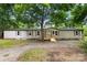 Charming single-story home with light siding and a welcoming wooden porch at 925 Crestland Dr, Clover, SC 29710