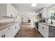 Bright kitchen featuring white cabinets, granite countertops, and stainless steel appliances at 925 Crestland Dr, Clover, SC 29710