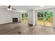 Cozy living room with a fireplace and access to the outdoor deck at 925 Crestland Dr, Clover, SC 29710