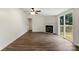 Open-concept living room with a fireplace and sliding glass doors to the deck at 925 Crestland Dr, Clover, SC 29710