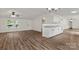 Open-concept living area with granite counters, new paint, and vinyl wood floors at 925 Crestland Dr, Clover, SC 29710