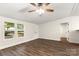 Bright living room with new vinyl floors, fresh white paint, and a ceiling fan at 925 Crestland Dr, Clover, SC 29710