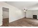 Spacious living room with a fireplace and wood-look floors, perfect for entertaining and cozy nights at 925 Crestland Dr, Clover, SC 29710