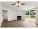 Inviting living room with a fireplace, ceiling fan, and access to the outdoor deck at 925 Crestland Dr, Clover, SC 29710