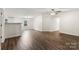 Open floor plan features wood-look vinyl floors, fresh paint, and modern lighting at 925 Crestland Dr, Clover, SC 29710