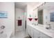 Bathroom features a double sink vanity, large mirror and a combined tub and shower at 9359 Hillston Ridge Rd, Huntersville, NC 28078