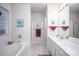 Bathroom featuring double sink vanity, a soaking tub, tile floors and a shower at 9359 Hillston Ridge Rd, Huntersville, NC 28078