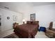 Bedroom features a bed, nightstand with lamp and a decorative rug on the floor at 9359 Hillston Ridge Rd, Huntersville, NC 28078