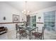 Elegant dining room with a unique table setting and ample natural light at 9359 Hillston Ridge Rd, Huntersville, NC 28078