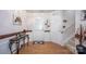 Inviting foyer with wood floors, a glass table, and a staircase at 9359 Hillston Ridge Rd, Huntersville, NC 28078