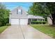 Charming home with a two-car garage and well-maintained front yard at 9359 Hillston Ridge Rd, Huntersville, NC 28078