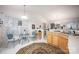 Eat-in kitchen features a breakfast nook with table and chairs plus light wood cabinets at 9359 Hillston Ridge Rd, Huntersville, NC 28078