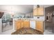 Functional kitchen with light wood cabinetry and a view of the dining area at 9359 Hillston Ridge Rd, Huntersville, NC 28078