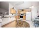 Well-lit kitchen with light cabinets, white appliances, and casual dining space at 9359 Hillston Ridge Rd, Huntersville, NC 28078