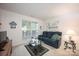 Cozy den with comfortable seating and natural light, perfect for relaxation at 9359 Hillston Ridge Rd, Huntersville, NC 28078