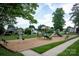 Community playground includes swings, slides, and various climbing structures on wood mulch at 9359 Hillston Ridge Rd, Huntersville, NC 28078