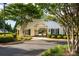 Community clubhouse and pool entrance with lush landscaping and manicured bushes at 9359 Hillston Ridge Rd, Huntersville, NC 28078