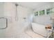 Luxurious bathroom with a soaking tub, walk-in shower, and elegant tile work at 108 Balmoral Dr, Mooresville, NC 28117