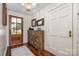Stylish entryway featuring hardwood floors, shiplap walls, a wooden door, and decorative accents at 108 Balmoral Dr, Mooresville, NC 28117