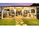 Stylish gazebo with outdoor kitchen, comfortable seating, and scenic views of the lake at sunset at 108 Balmoral Dr, Mooresville, NC 28117