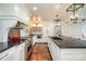 Kitchen with a large island, stainless steel appliances, custom cabinets, and modern lighting at 108 Balmoral Dr, Mooresville, NC 28117