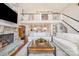 Elegant living room with a stone fireplace, stylish furnishings, and open floor plan at 108 Balmoral Dr, Mooresville, NC 28117