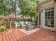 Spacious back deck with outdoor seating, perfect for entertaining and enjoying the serene backyard view at 10924 Lederer Ave, Charlotte, NC 28277