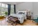Bright bedroom with a large window and light hardwood floors at 10924 Lederer Ave, Charlotte, NC 28277