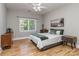 Bedroom featuring neutral colors, hardwood floors, and natural light at 10924 Lederer Ave, Charlotte, NC 28277