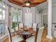 Breakfast nook with many windows and ceiling fan at 10924 Lederer Ave, Charlotte, NC 28277