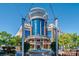 Attractive view of the building exterior with Regal Cinemas sign, an outdoor fountain, and plenty of outdoor seating at 10924 Lederer Ave, Charlotte, NC 28277