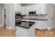 Well-appointed kitchen features stainless steel appliances, granite countertops, and an island at 10924 Lederer Ave, Charlotte, NC 28277