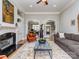Inviting living room with fireplace, detailed trim and archways to office and entry at 10924 Lederer Ave, Charlotte, NC 28277