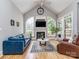 Living room with vaulted ceilings, fireplace, lots of natural light, and hardwood floors at 10924 Lederer Ave, Charlotte, NC 28277