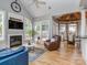 Open floor plan with fireplace, hardwood floors and vaulted ceilings lead to breakfast nook at 10924 Lederer Ave, Charlotte, NC 28277