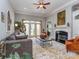 Cozy living room with a fireplace, large windows, and comfortable seating at 10924 Lederer Ave, Charlotte, NC 28277