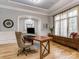 Stylish home office with a modern desk, hardwood floors, and natural light at 10924 Lederer Ave, Charlotte, NC 28277