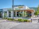 Exterior view of a Flower restaurant, showcasing modern architecture and inviting outdoor seating area at 10924 Lederer Ave, Charlotte, NC 28277