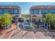 Vibrant outdoor shopping center with shops and restaurants, featuring a fountain and colorful seating at 10924 Lederer Ave, Charlotte, NC 28277