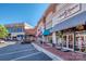Shopping center storefront view with retail stores, awnings, and parking in front of the buildings at 10924 Lederer Ave, Charlotte, NC 28277