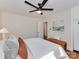 Cozy bedroom with white linens, stylish decor, and a modern ceiling fan for added comfort at 1147 Norland Rd, Charlotte, NC 28205