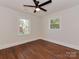 Spacious bedroom with hardwood floors, natural light, and ceiling fan offers a comfortable retreat at 1147 Norland Rd, Charlotte, NC 28205