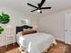 Inviting bedroom featuring neutral decor, hardwood floors, and a ceiling fan at 1147 Norland Rd, Charlotte, NC 28205