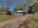 Charming home featuring a long driveway and a well manicured lawn at 1147 Norland Rd, Charlotte, NC 28205