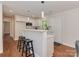 Kitchen featuring white cabinets, stainless steel appliances, and a breakfast bar with seating at 1147 Norland Rd, Charlotte, NC 28205