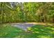 A large, secluded space in the backyard is ideal for parking or outdoor activities at 11861 Nc Hwy 73 E Hwy, Mount Pleasant, NC 28124