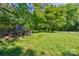 The backyard has an animal pen in a secluded setting near mature trees at 11861 Nc Hwy 73 E Hwy, Mount Pleasant, NC 28124