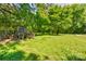 The backyard has an animal pen in a secluded setting near mature trees at 11861 Nc Hwy 73 E Hwy, Mount Pleasant, NC 28124