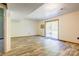The basement has light-colored wood floors, bright white walls, and sliding glass doors to the backyard at 11861 Nc Hwy 73 E Hwy, Mount Pleasant, NC 28124